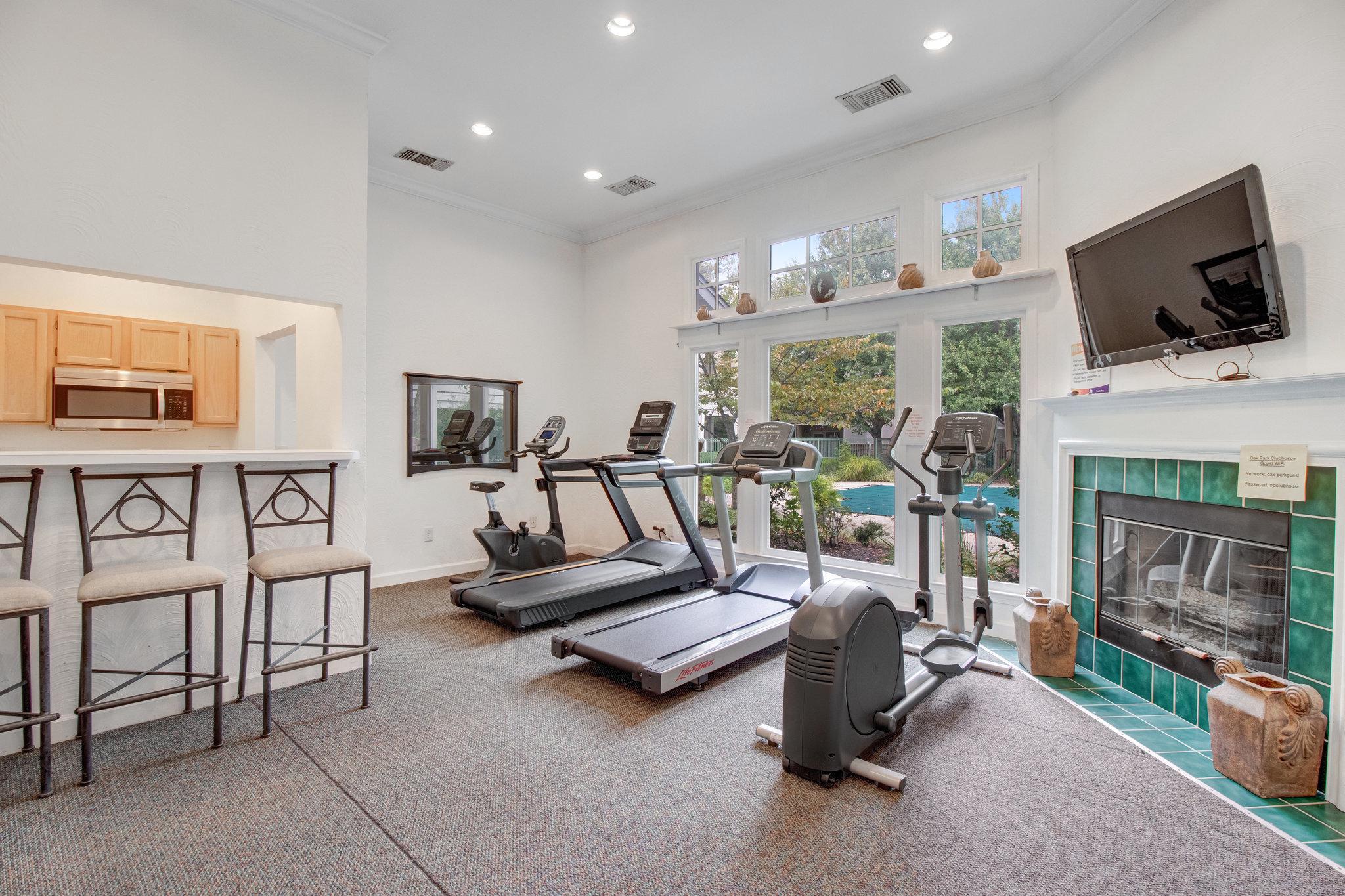 12005 Taliesin Place, Unit 36 Reston, VA 20190 - Photo 34 of 37 Bright community room and gym overlooking the pool