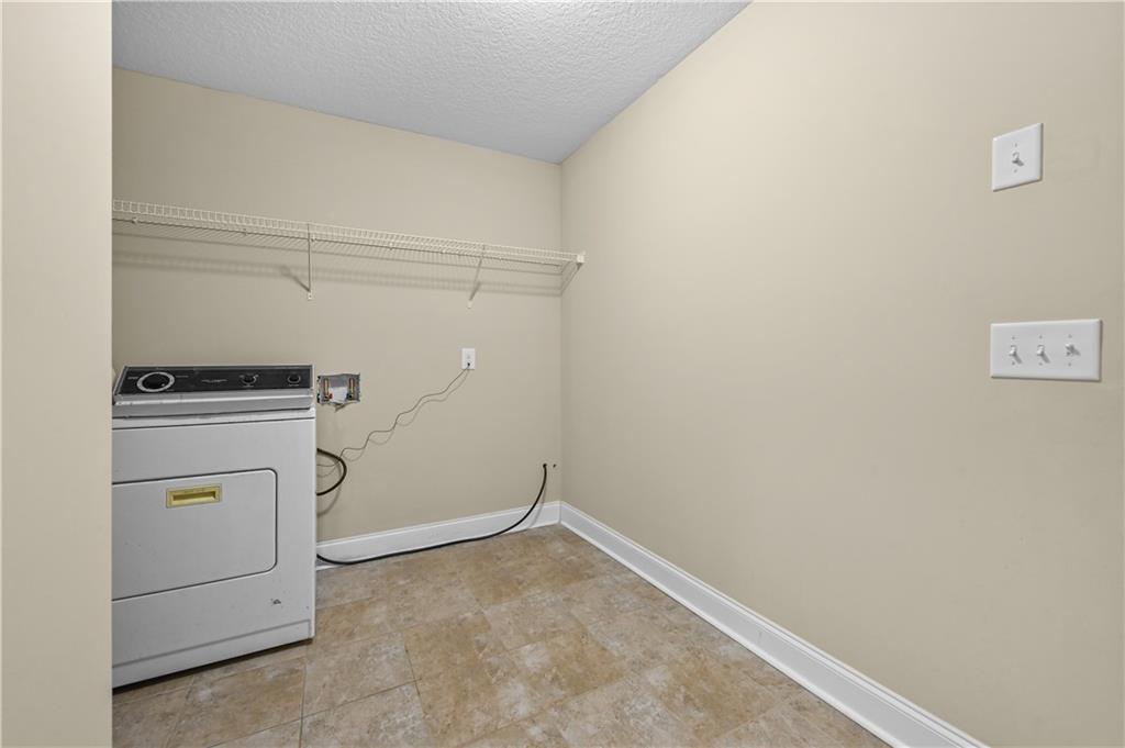9 Bailee Circle Colbert, GA 30628 - Photo 15 of 30 a view of storage and utility room with washer and dryer