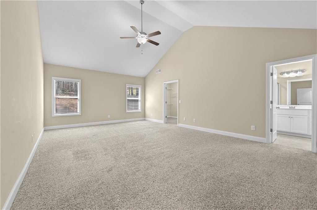 9 Bailee Circle Colbert, GA 30628 - Photo 16 of 30 an empty room with windows and chandelier fan