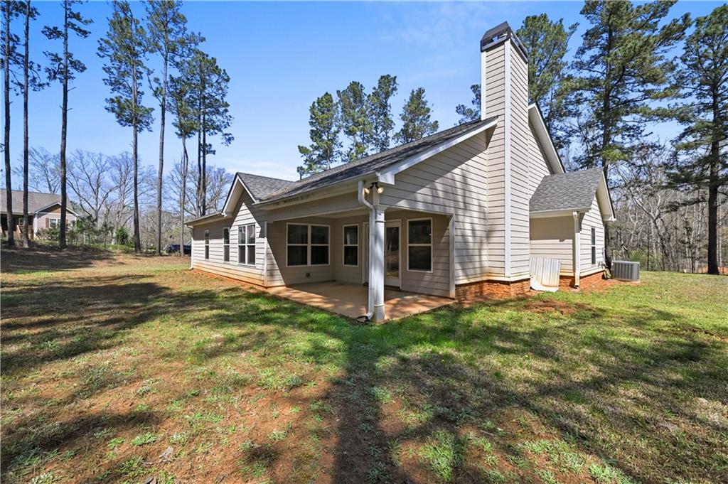 9 Bailee Circle Colbert, GA 30628 - Photo 26 of 30 a view of a house with a yard