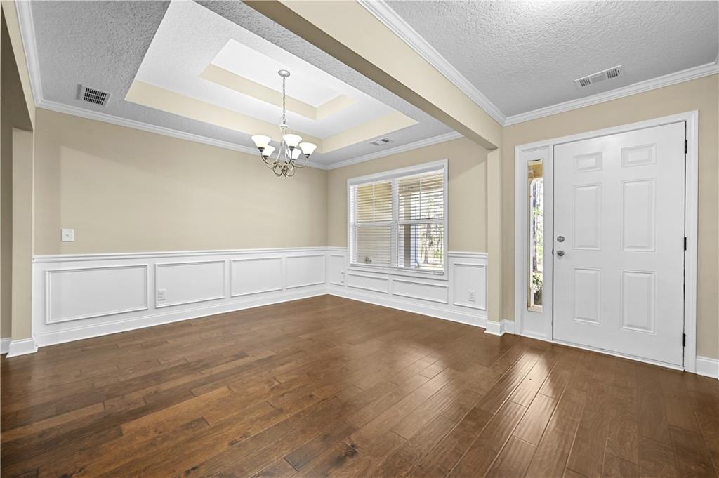 9 Bailee Circle Colbert, GA 30628 - Photo 3 of 30 a view of an empty room with wooden floor and a window