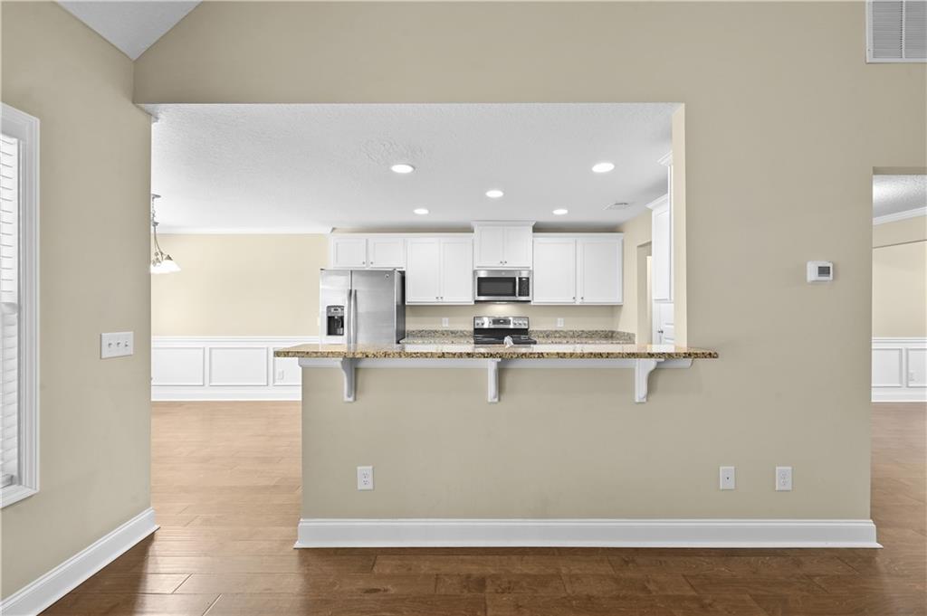 9 Bailee Circle Colbert, GA 30628 - Photo 9 of 30 a view of kitchen with stainless steel appliances refrigerator sink and cabinets