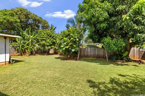 a backyard of a house with lots of green space