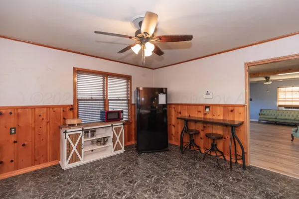 an empty room with furniture and wooden floor