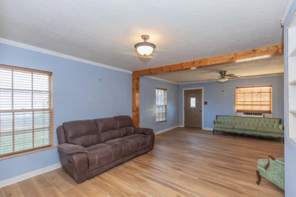 a living room with furniture and a window