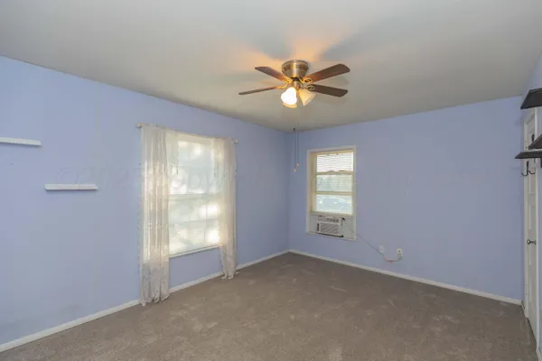 a view of empty room with windows