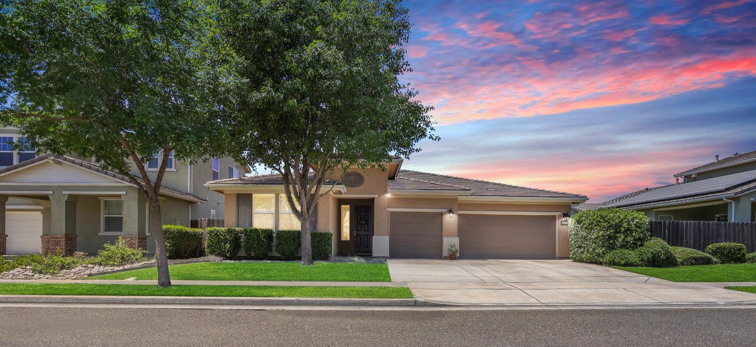 1959 Deborah Circle Escalon, CA 95320 - Photo 1 of 1 a front view of a house with a yard and garage