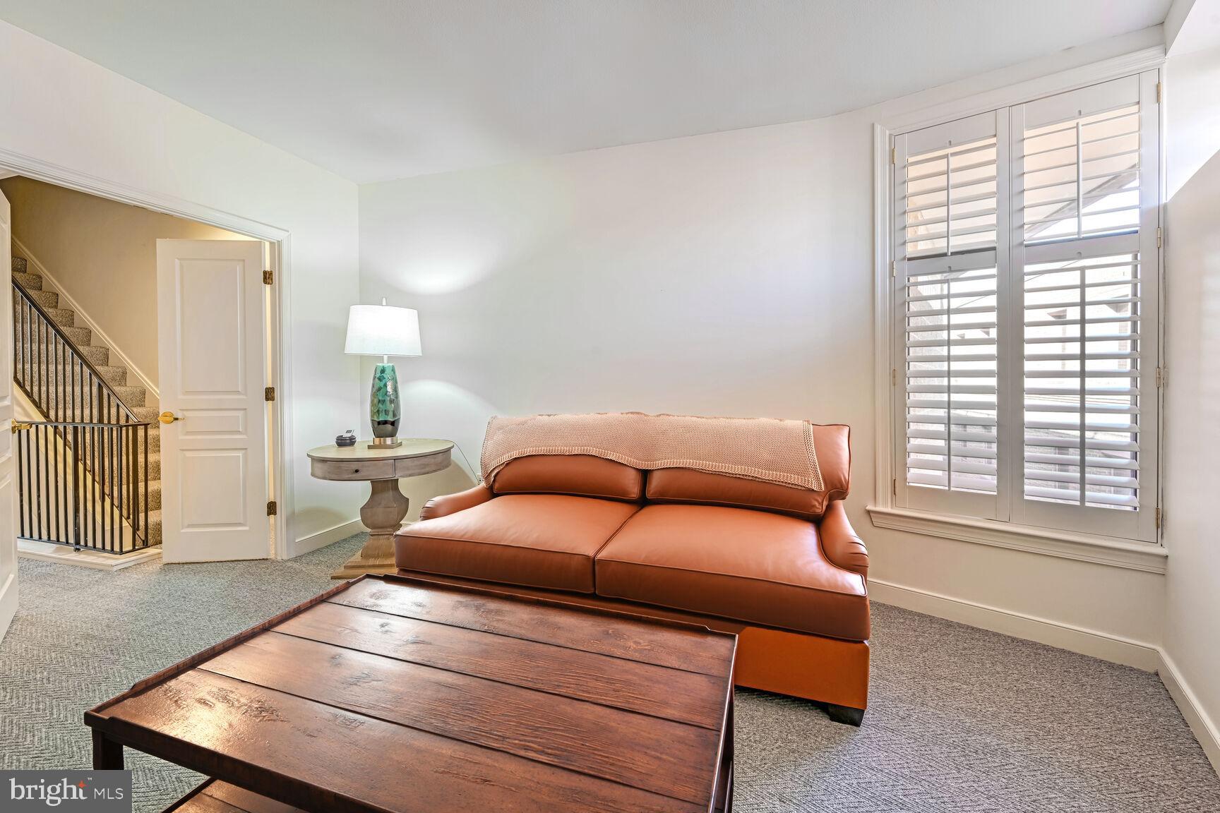 616 E Street Northwest, Unit 1150 Washington, DC 20004 - Photo 18 of 75 a bedroom with a bed and a window with wooden floor