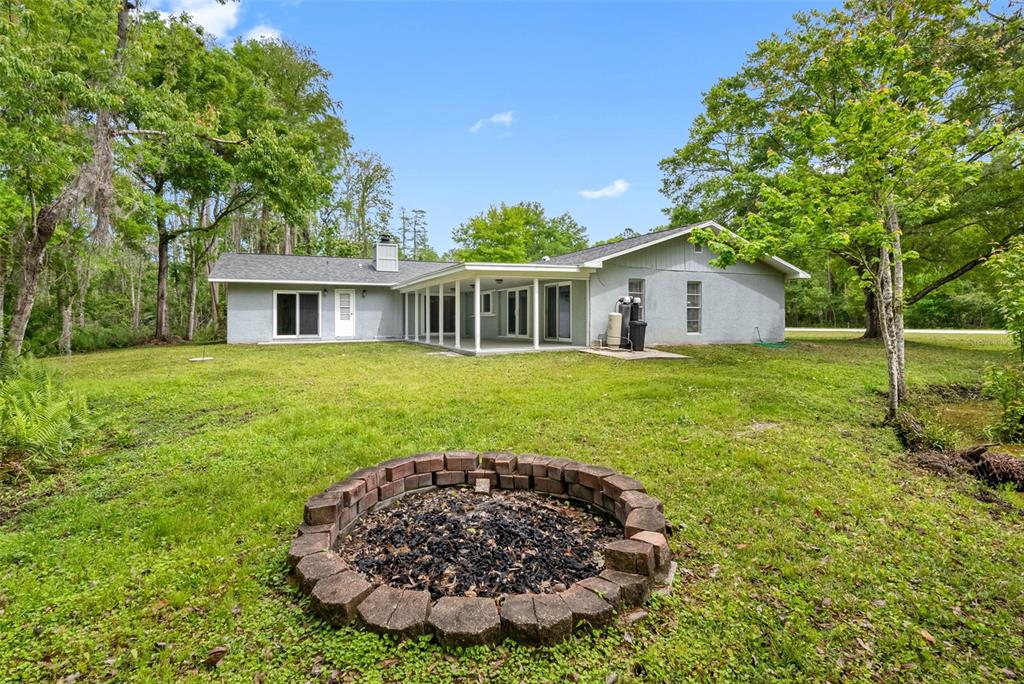 346 Ranch Road Tarpon Springs, FL 34688 - Photo 13 of 64 a view of a house with a backyard