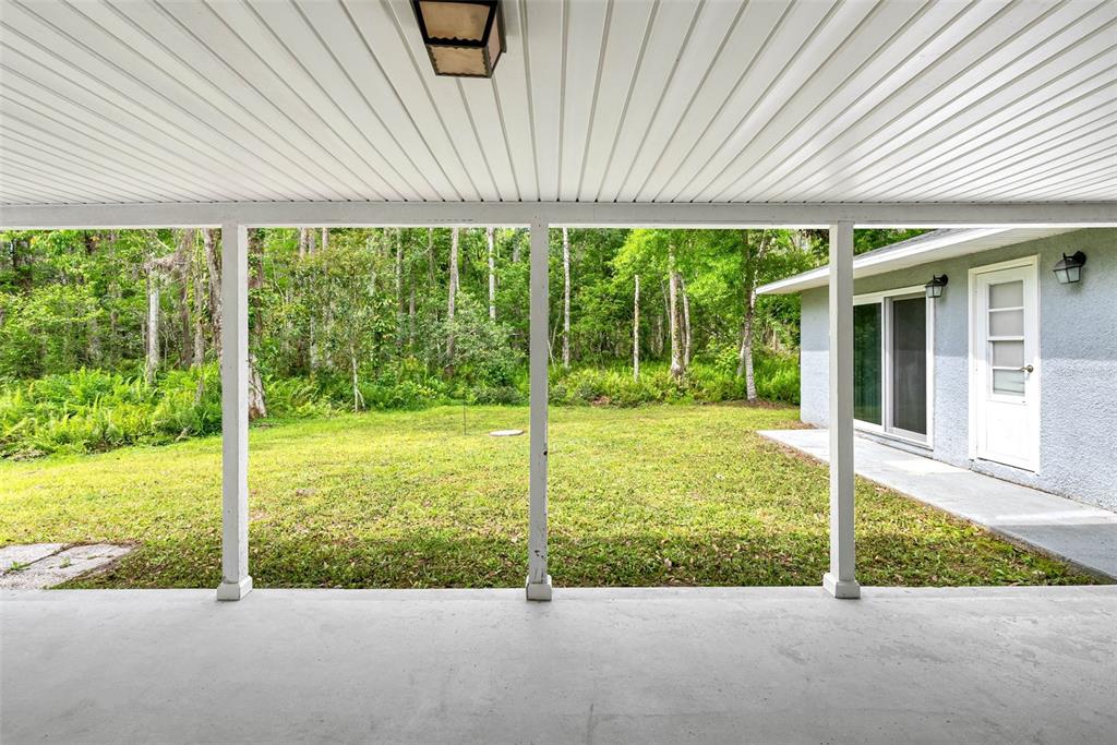 346 Ranch Road Tarpon Springs, FL 34688 - Photo 17 of 64 a view of a house with backyard and a garden