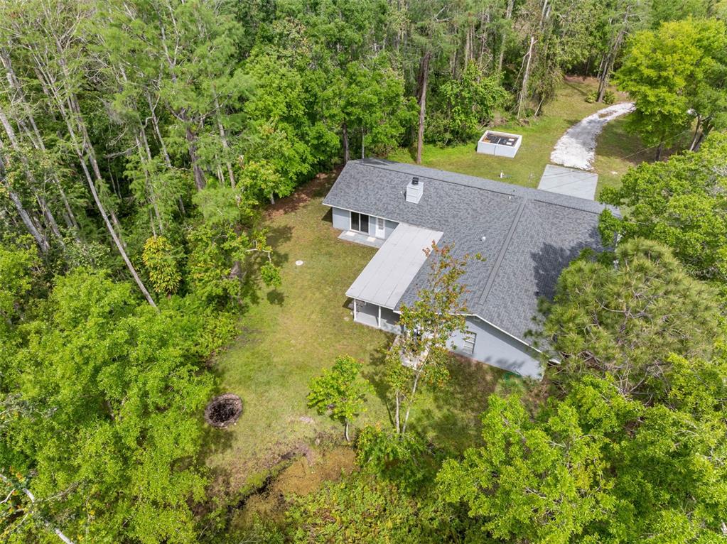 346 Ranch Road Tarpon Springs, FL 34688 - Photo 2 of 64 an aerial view of a house with yard swimming pool and outdoor seating