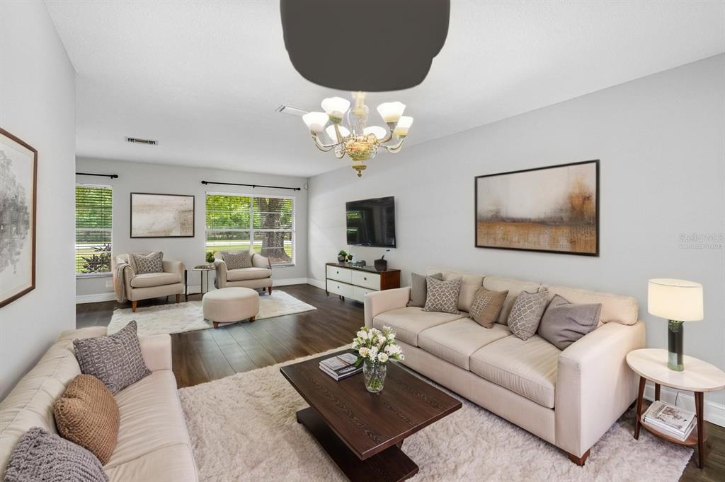 346 Ranch Road Tarpon Springs, FL 34688 - Photo 24 of 64 a living room with furniture a bed and a couch