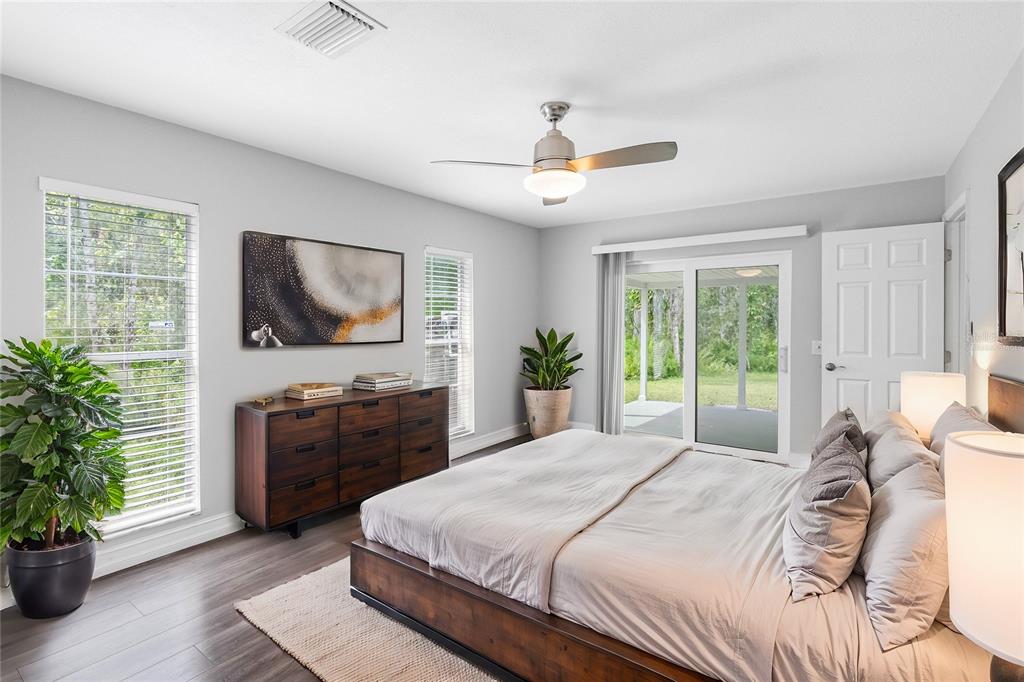 346 Ranch Road Tarpon Springs, FL 34688 - Photo 31 of 64 a bedroom with a large bed and a flat screen television