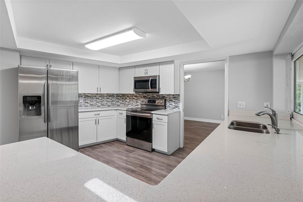 346 Ranch Road Tarpon Springs, FL 34688 - Photo 38 of 64 a kitchen with a refrigerator stove and microwave