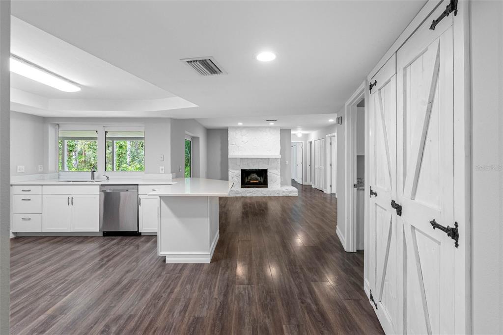 346 Ranch Road Tarpon Springs, FL 34688 - Photo 40 of 64 a view of a kitchen with wooden floor and a window