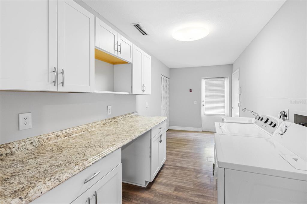 346 Ranch Road Tarpon Springs, FL 34688 - Photo 42 of 64 a kitchen with a sink and cabinets