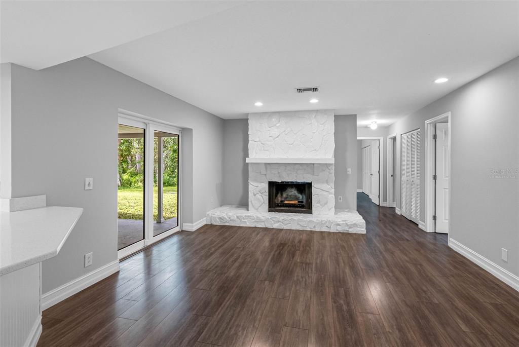 346 Ranch Road Tarpon Springs, FL 34688 - Photo 46 of 64 a view of an empty room with wooden floor and a window