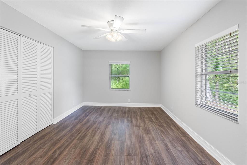 346 Ranch Road Tarpon Springs, FL 34688 - Photo 57 of 64 a view of an empty room with wooden floor and a window