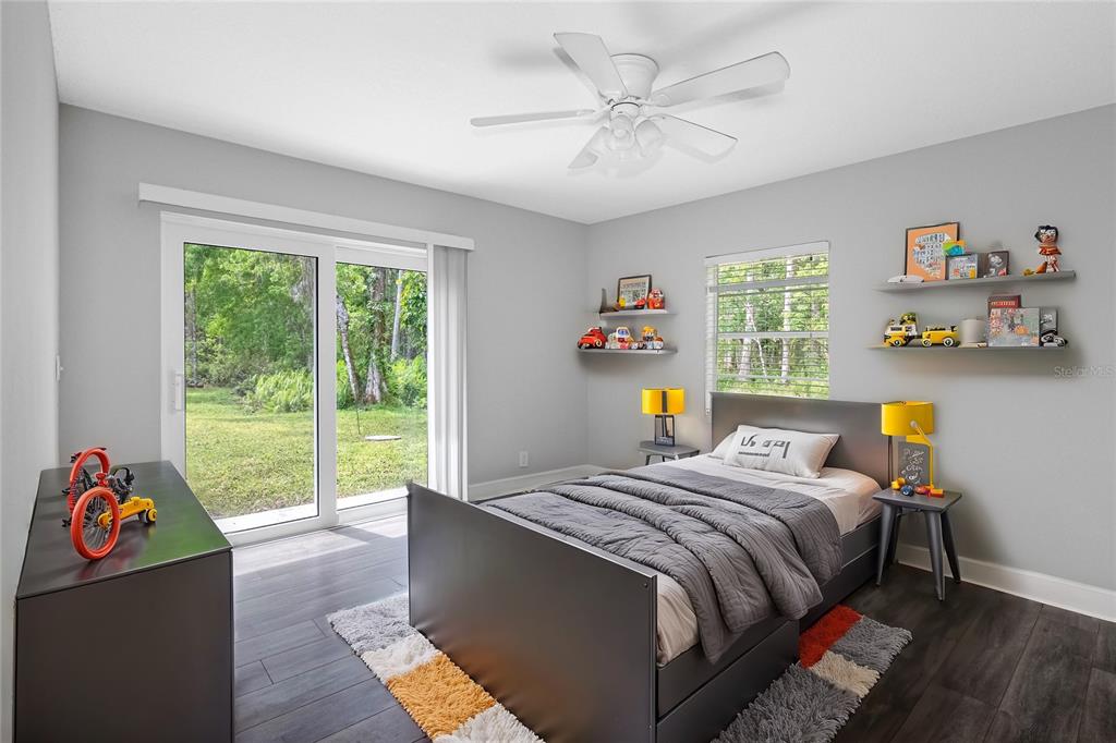 346 Ranch Road Tarpon Springs, FL 34688 - Photo 59 of 64 a bed sitting in a bedroom next to a window