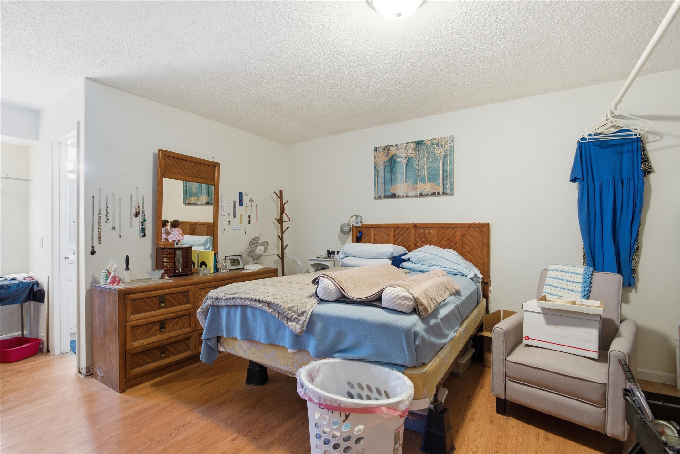 2000 Magazine Street Austin, TX 78727 - Photo 12 of 30 Hardwood floors and bright white walls create a welcoming, comfortable bedroom.