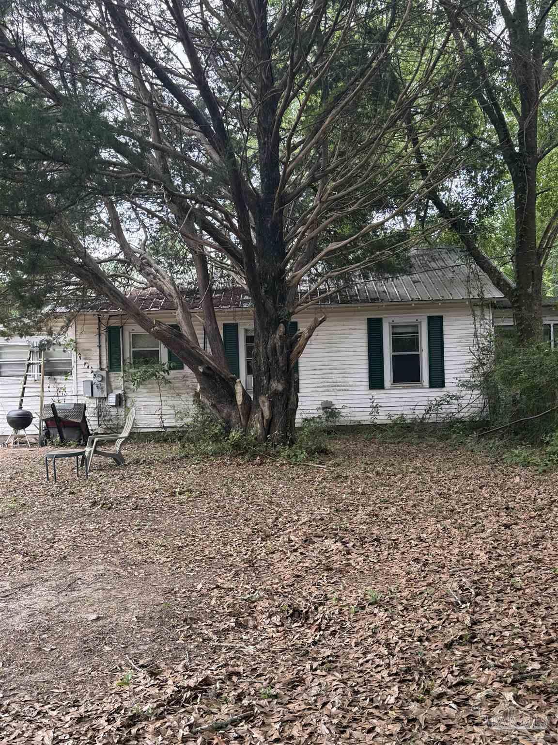 6042 Enfinger Road Pace, FL 32571 - Photo 5 of 10 a view of a house with a yard