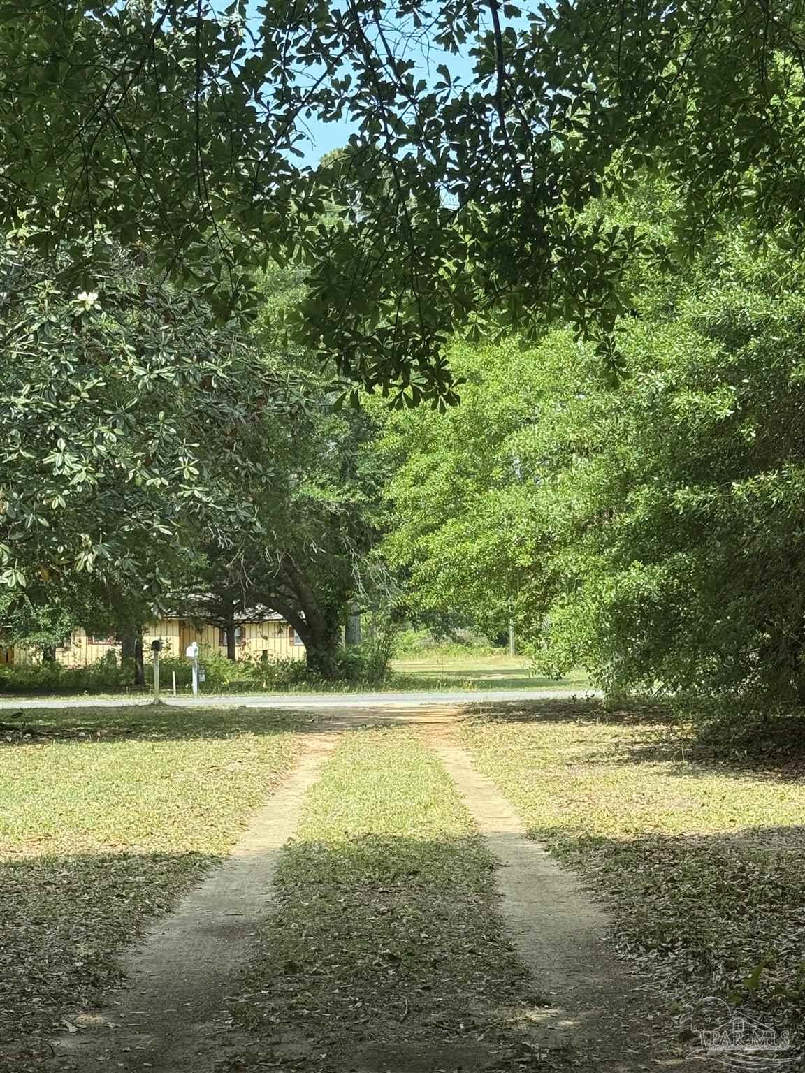 6042 Enfinger Road Pace, FL 32571 - Photo 10 of 10 a view of a yard with an outdoor space