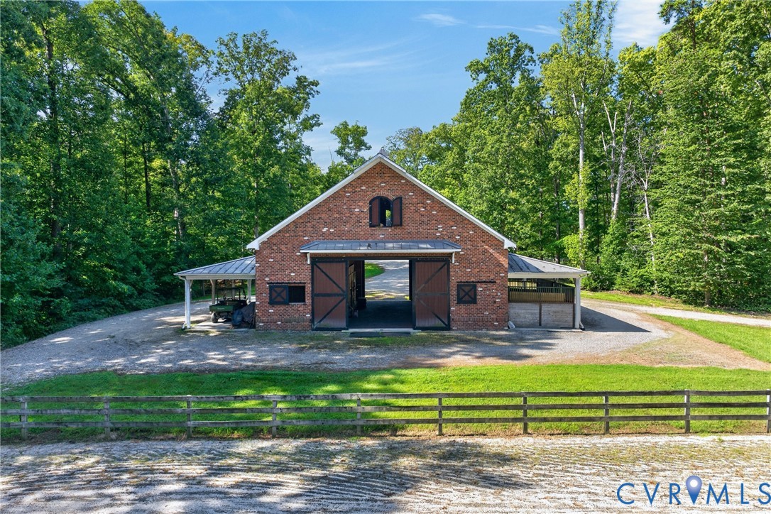 1108 Shallow Well Road Manakin-Sabot, VA 23103 - Photo 77 of 86 Brick barn structure with a metal roof, featuring