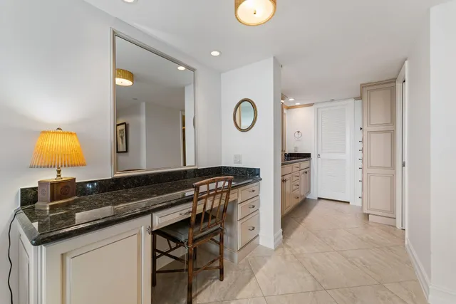 a kitchen with a sink cabinets and stove