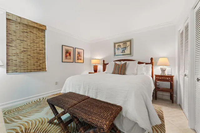 a bedroom with a bed and cupboard