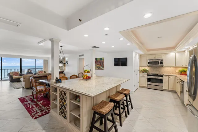 a view of kitchen with cabinets table and chairs