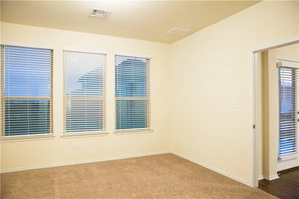 a bathroom with a shower and a sink
