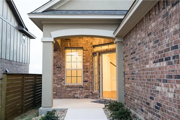a front view of a house with a outdoor space