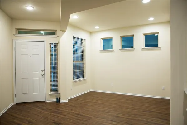 a view of a livingroom with wooden floor