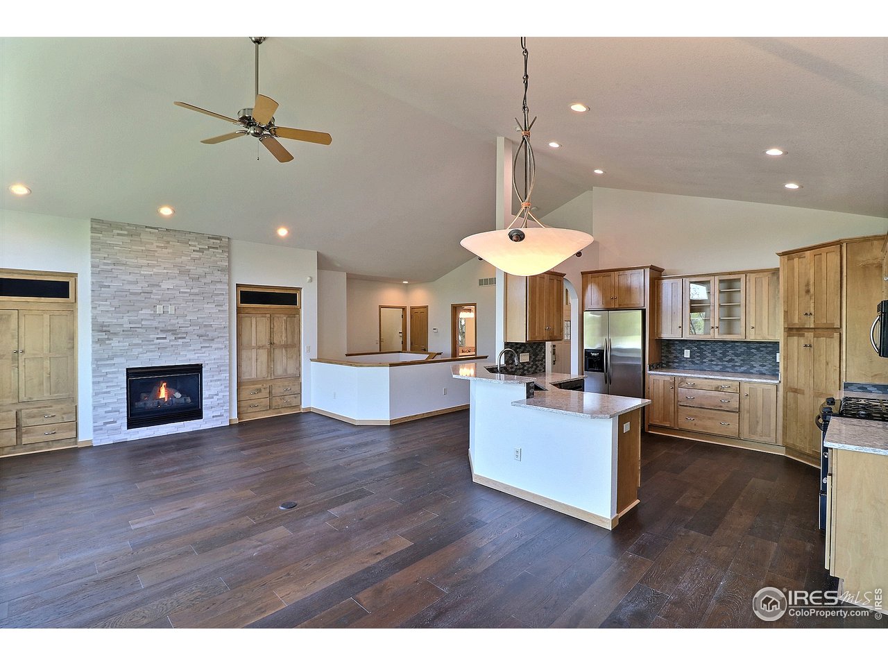 7205 Poudre River Road, Unit 3 Greeley, CO 80634 - Photo 5 of 27 Stacked stone fireplace