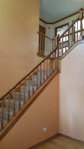 1102 Gulf Keys Road Streamwood, IL 60120 - Photo 11 of 25 a view of staircase with lots of windows