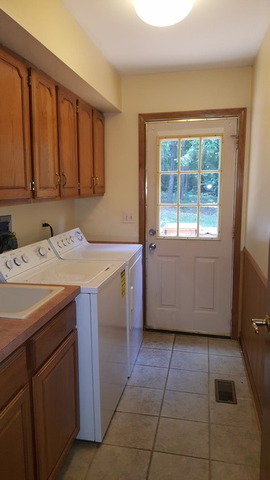 1102 Gulf Keys Road Streamwood, IL 60120 - Photo 13 of 25 a utility room with a sink washer and dryer
