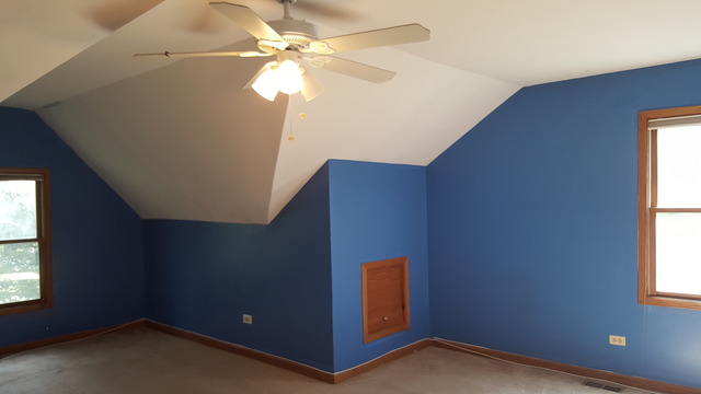 1102 Gulf Keys Road Streamwood, IL 60120 - Photo 21 of 25 an empty room with windows and fan