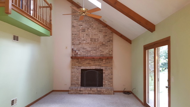 1102 Gulf Keys Road Streamwood, IL 60120 - Photo 8 of 25 a view of empty room with fireplace