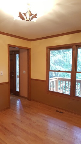1102 Gulf Keys Road Streamwood, IL 60120 - Photo 10 of 25 a view of an empty room with wooden floor and a window