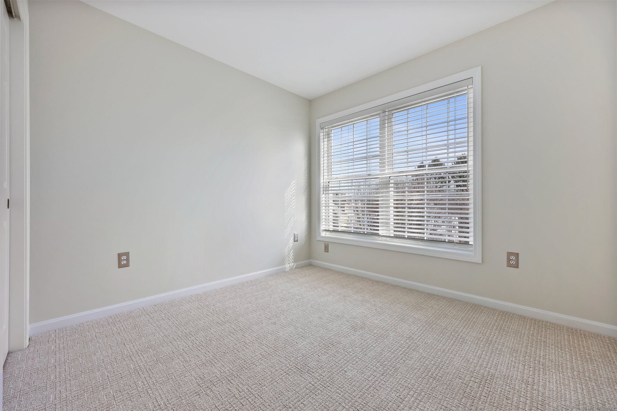 105 Dean Street, Unit A Stamford, CT 06902 - Photo 11 of 16 a view of an empty room with a window