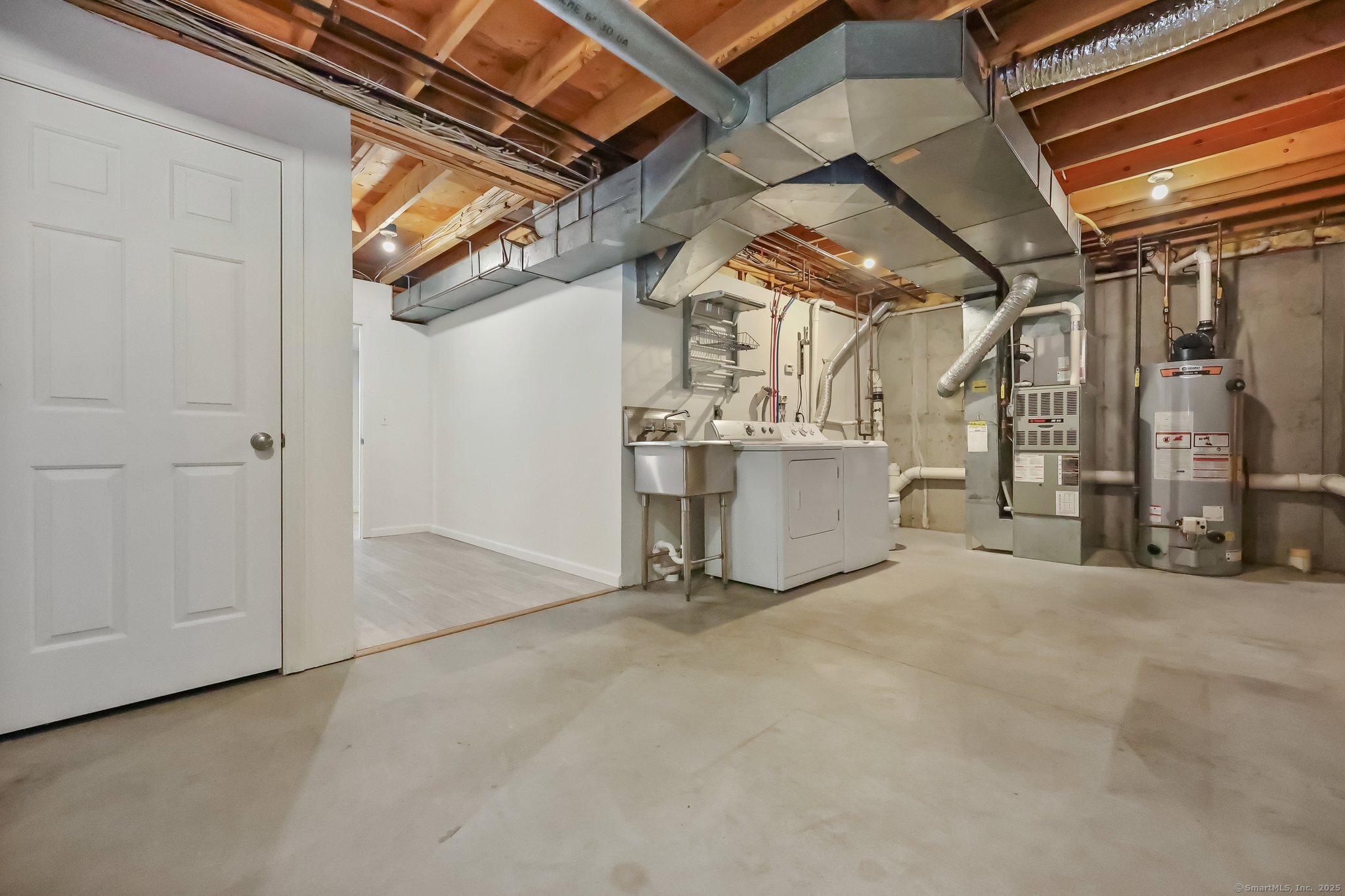 105 Dean Street, Unit A Stamford, CT 06902 - Photo 15 of 16 a view of a room with storage and utility