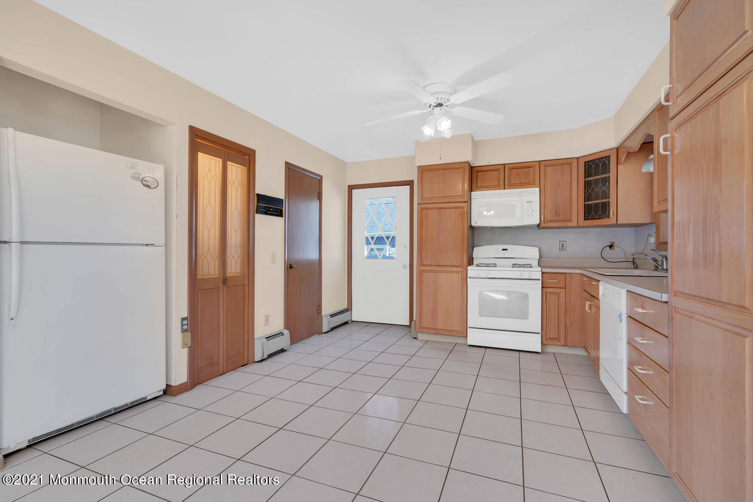 19 North Island Road Bayville, NJ 08721 - Photo 16 of 54 a kitchen with stainless steel appliances a refrigerator sink and cabinets