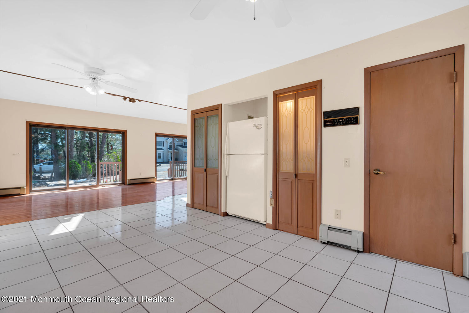 19 North Island Road Bayville, NJ 08721 - Photo 17 of 54 a view of empty room with wooden floor and large window