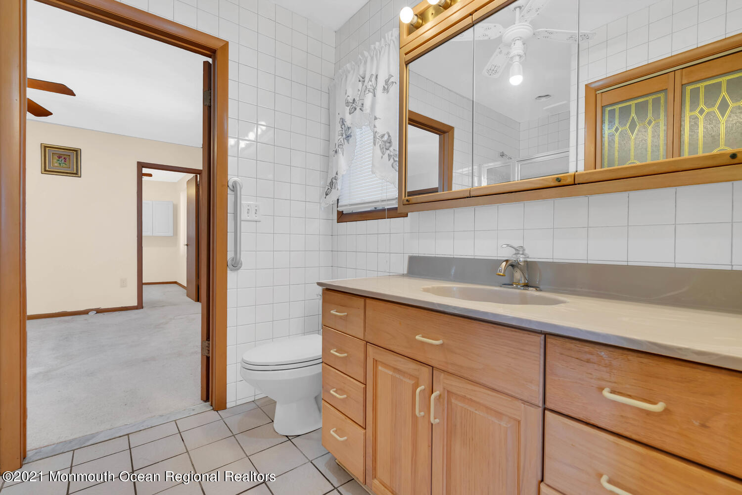 19 North Island Road Bayville, NJ 08721 - Photo 22 of 54 a bathroom with a sink a toilet and mirror