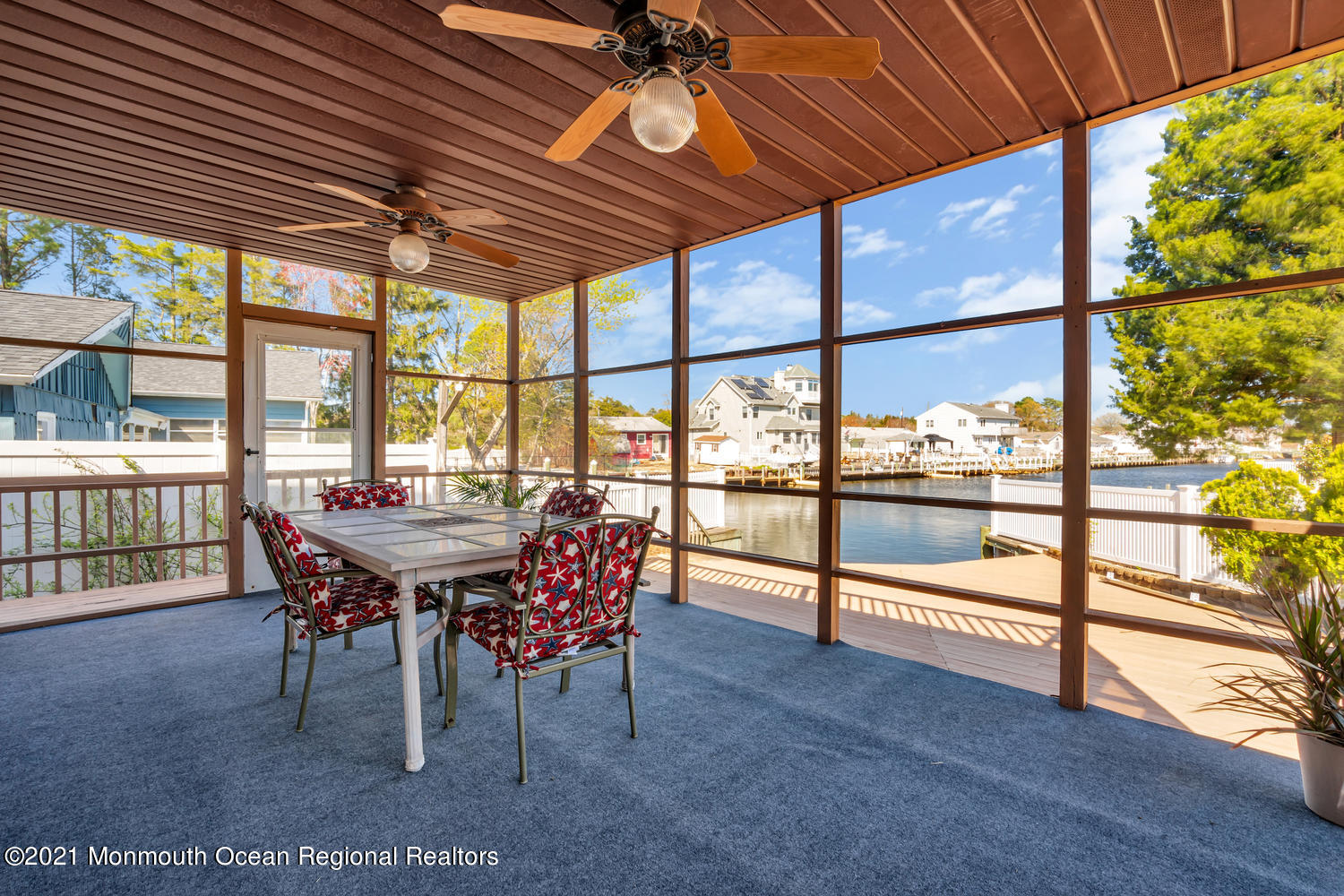 19 North Island Road Bayville, NJ 08721 - Photo 42 of 54 a dining room with furniture a rug and a large window