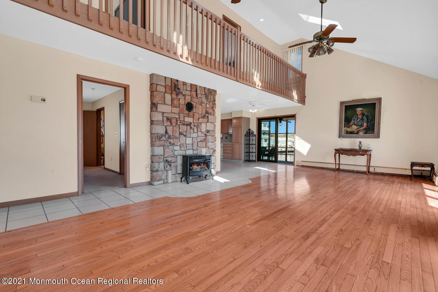 19 North Island Road Bayville, NJ 08721 - Photo 7 of 54 a view of a livingroom with furniture a ceiling fan and fireplace
