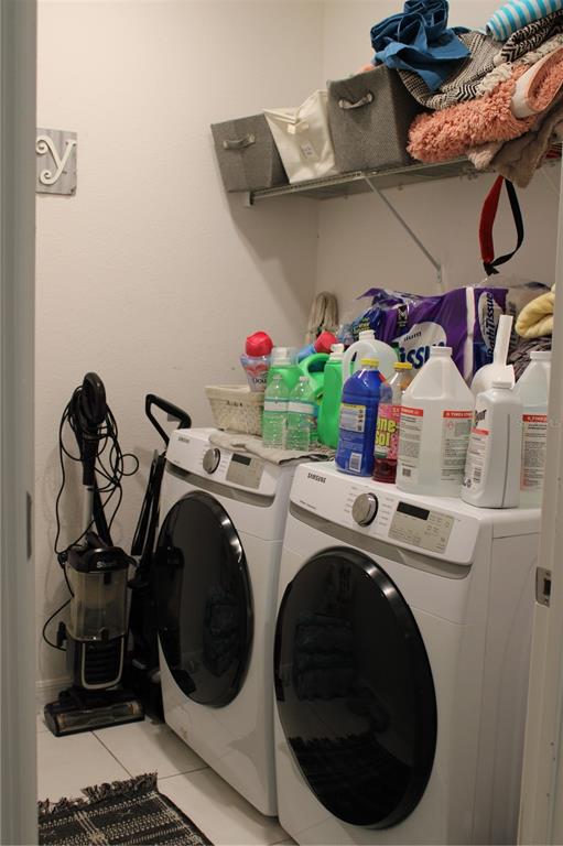 2591 Wadeview Loop St. Cloud, FL 34769 - Photo 16 of 18 a utility room with dryer and washer