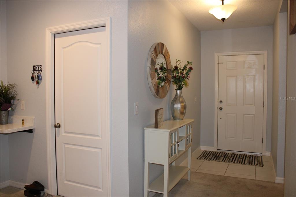 2591 Wadeview Loop St. Cloud, FL 34769 - Photo 3 of 18 a view of a hallway with workspace