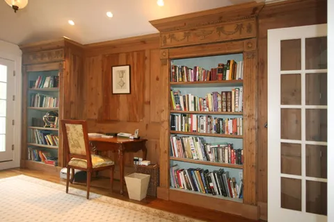a view of a workspace with furniture and cabinet