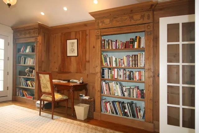 a view of a workspace with furniture and cabinet